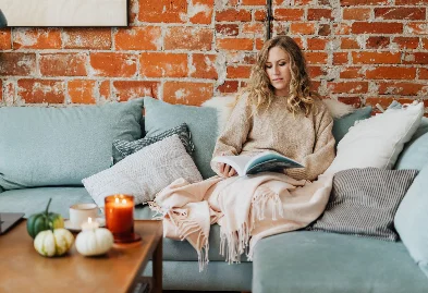 Stylish woman relaxing in a beautiful home setting